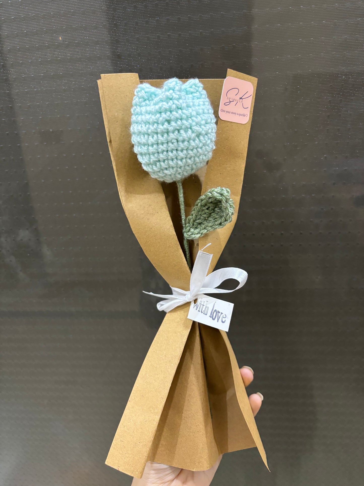 Crochet tulip with complementary khaaki wrapping