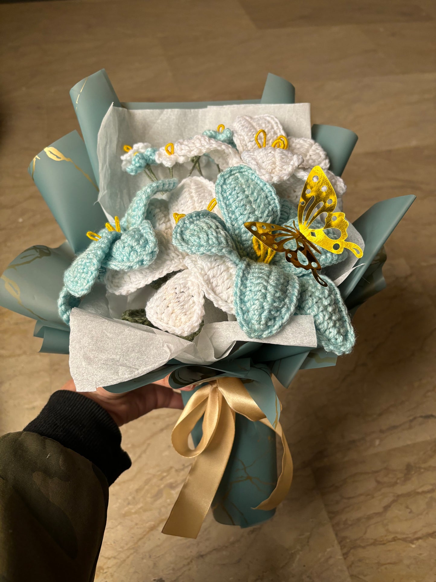 Crochet blue themed bouquet featuring lilies and forget me not flowers