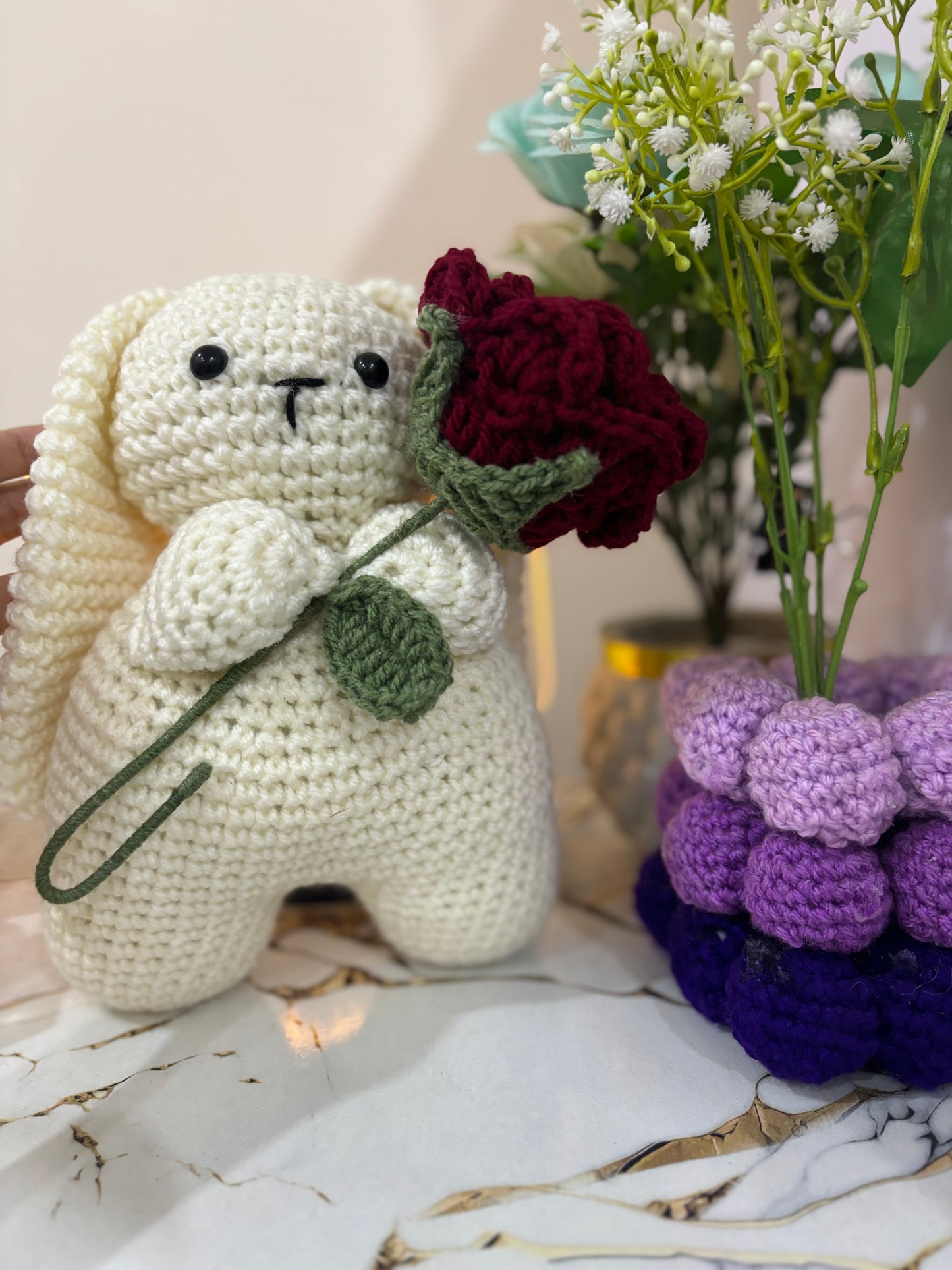 Crochet bunny holding rose
