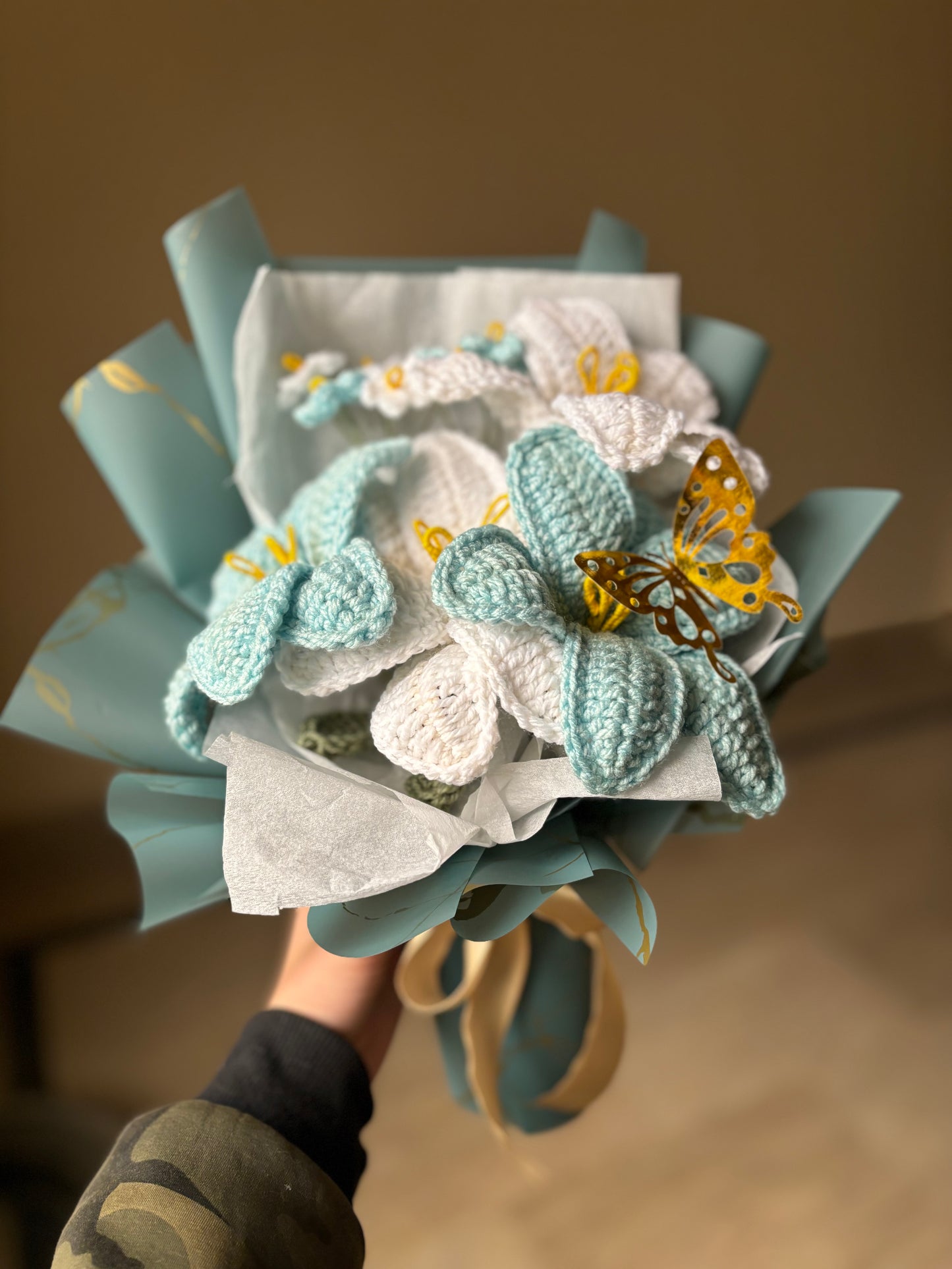 Crochet blue themed bouquet featuring lilies and forget me not flowers