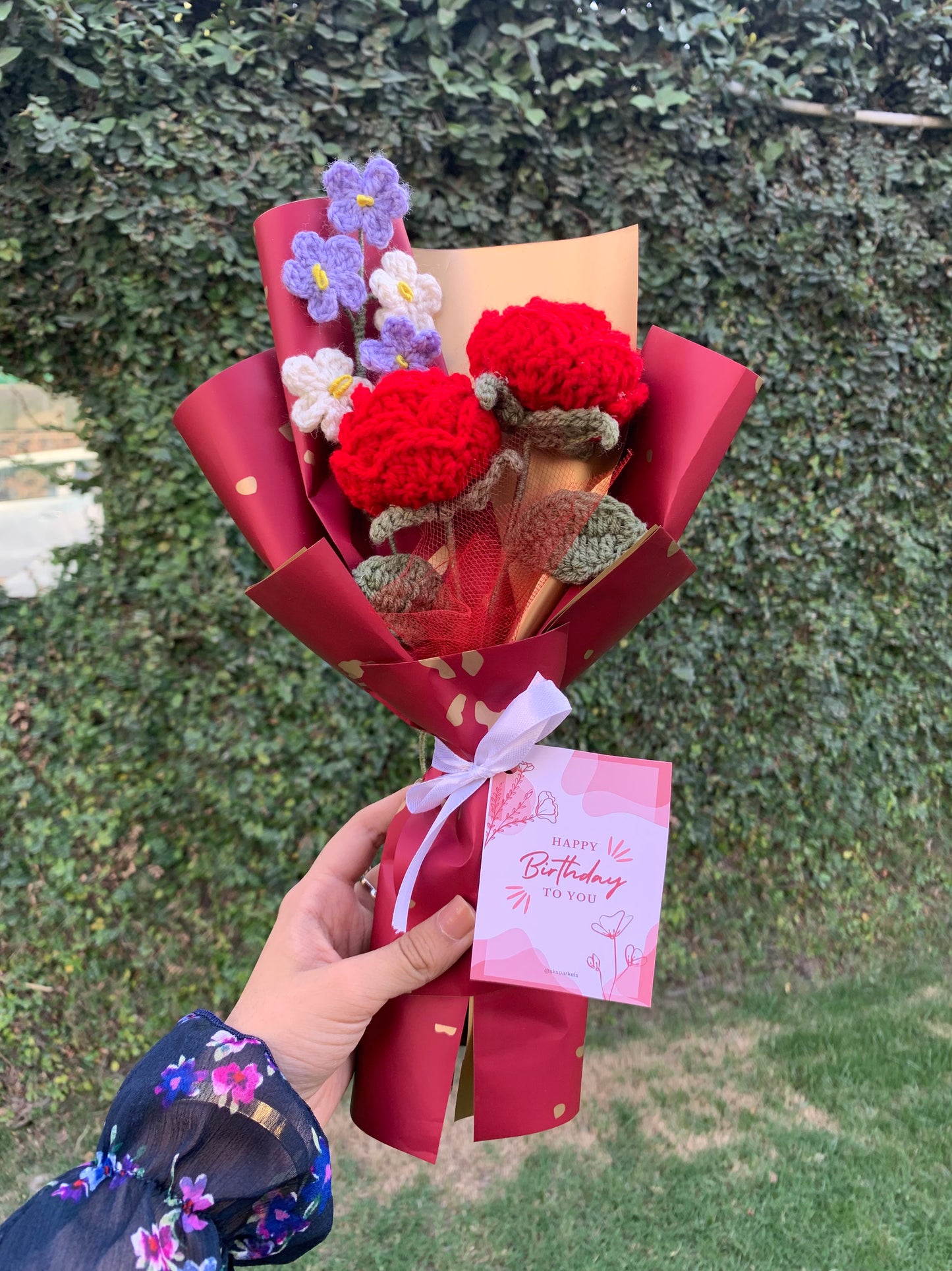 Crochet red roses bouquet with birthday card