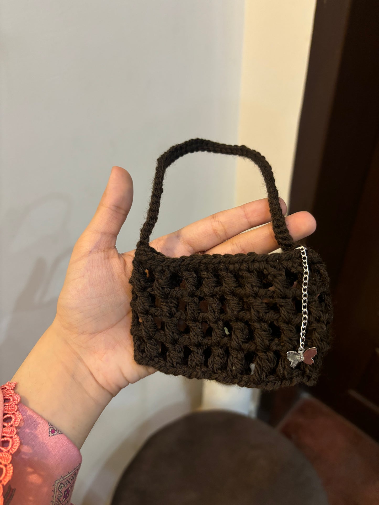 Crochet mesh cup holder with butterfly charm