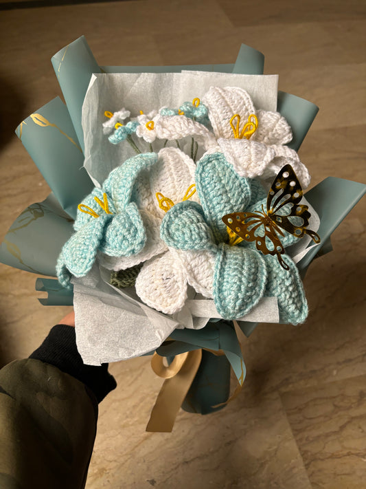 Crochet blue themed bouquet featuring lilies and forget me not flowers