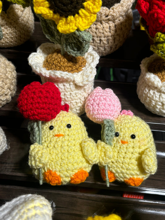 Crochet chick holding tulips