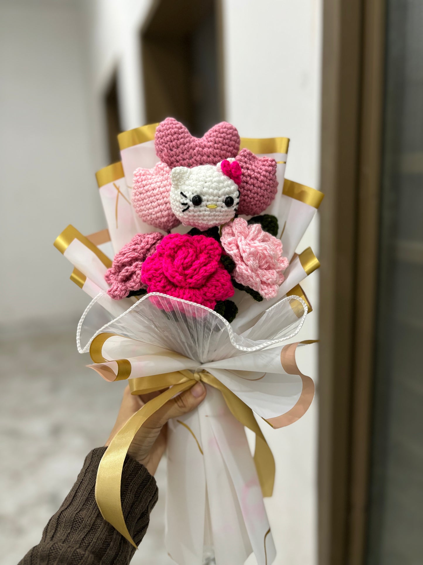 Crochet hello kitty themed bouquet with roses tulips and heart