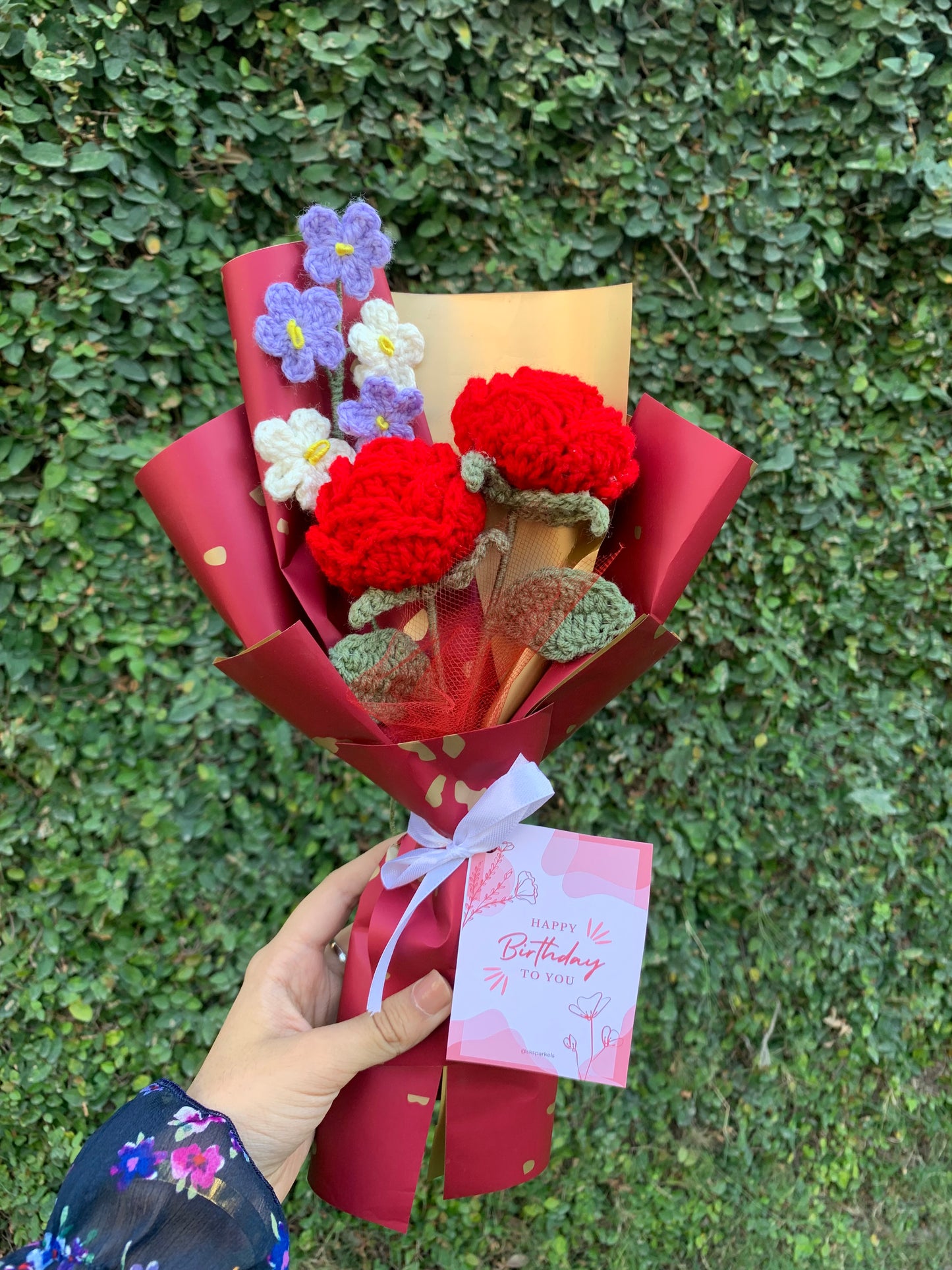 Crochet red roses bouquet with birthday card