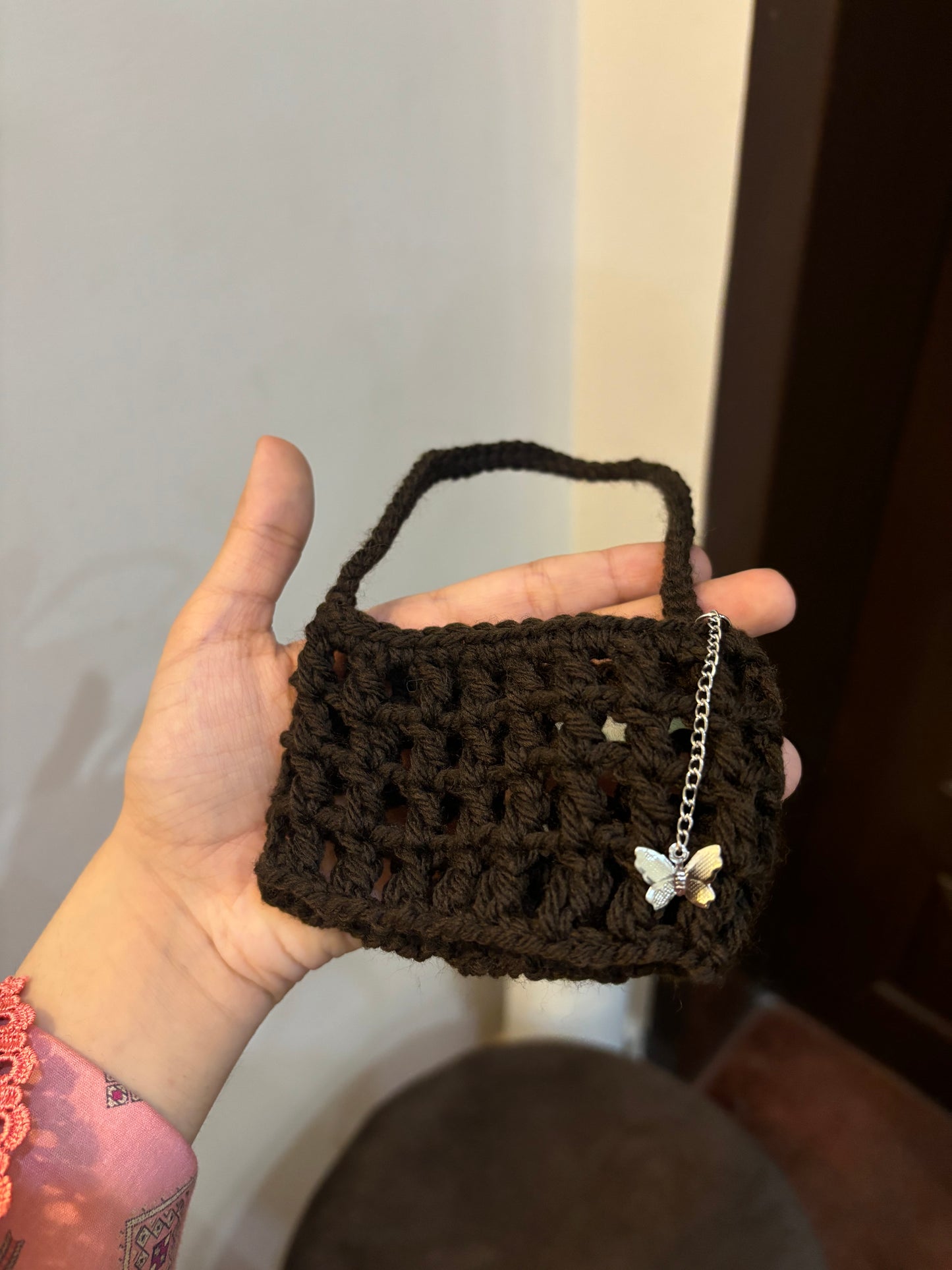Crochet mesh cup holder with butterfly charm