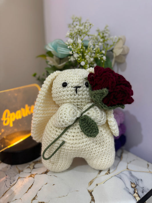 Crochet bunny holding rose